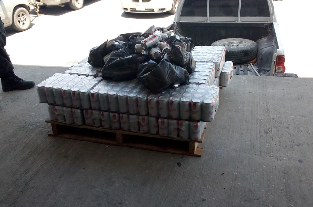 Cans of beer seized in Belize.